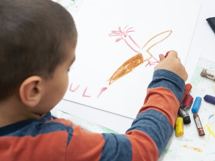 A child drawing on paper 